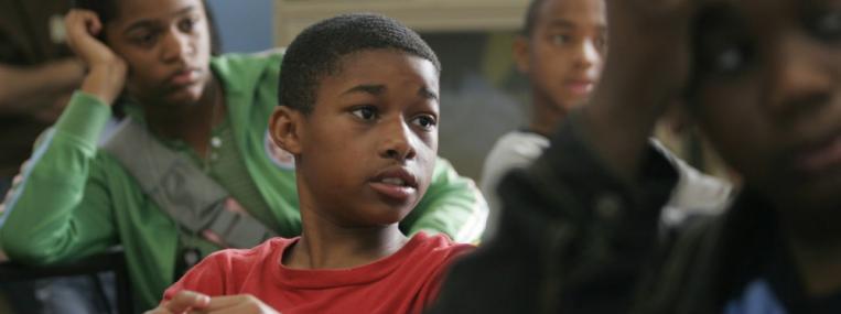A seventh grader at Samuel J. Green Charter School in New Orleans looks on in class. After Hurricane Katrina in 2005, the city’s school system was drastically restructured, with a new emphasis on charter schools geared toward college preparation. (Lee Celano / Reuters / Corbis)